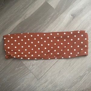 Brown polka dotted bathing suit bandeau top.